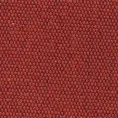 Terracotta woven fabric with a dense, repeating geometric dot pattern and matte finish; tight weave shows white fiber details.
